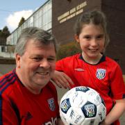 Dudley councillor Tim Crumpton and his granddaughter Kacey Bates, 9, are auctioning off a signed West Bromwich Albion football for our Well of Life appeal. 151511L