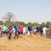 Students and staff from Ridgewood High School meet with Sintet villagers at the site of the farm.