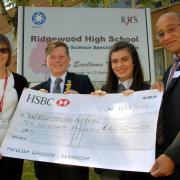 Deputy Mayor of Dudley Mohammed Hanif presenting a cheque to Ridgewood High School's Project Gambia leader Bev Hodt, head boy Ben Dunn, 15, and head girl Lydia Robinson, 14. 251508L