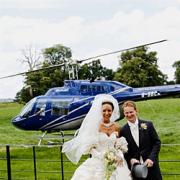 The happy couple, Gemma and Craig, arrive at their wedding reception after a surprise helicopter trip.