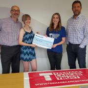 Andy and Imogen Westwood hand over a cheque to Emily Cooper of Teenage Cancer Trust, alongside Atotech’s managing director Russell Gregory