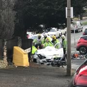 A woman had to be cut free from her car by West Midlands Fire Service crews after being involved in a two-car crash in Ham Lane, Pedmore, this morning.