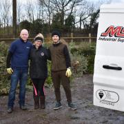 Laura Millard from Mary Stevens Hospice, centre, with volunteers from MSC Industrial Supply – Steve Tallent, left, and Lee Gray, right.