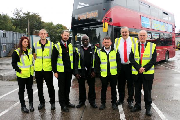 Dave Gerard, far right, with bus drivers and office staff