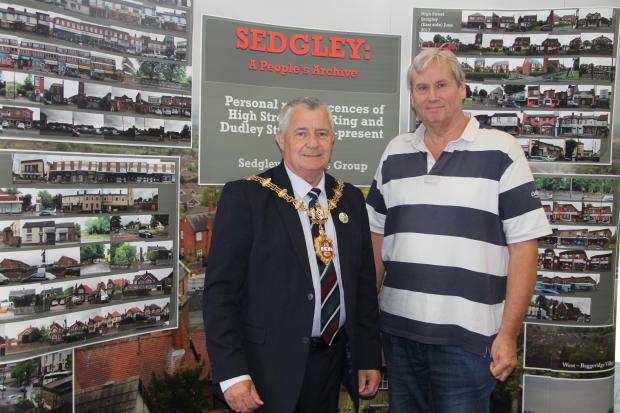 Project manager Martin Jones (right) and former Mayor of Dudley Dave Tyler, with 170 photos for the Reminiscence Cafe 'Shops' project